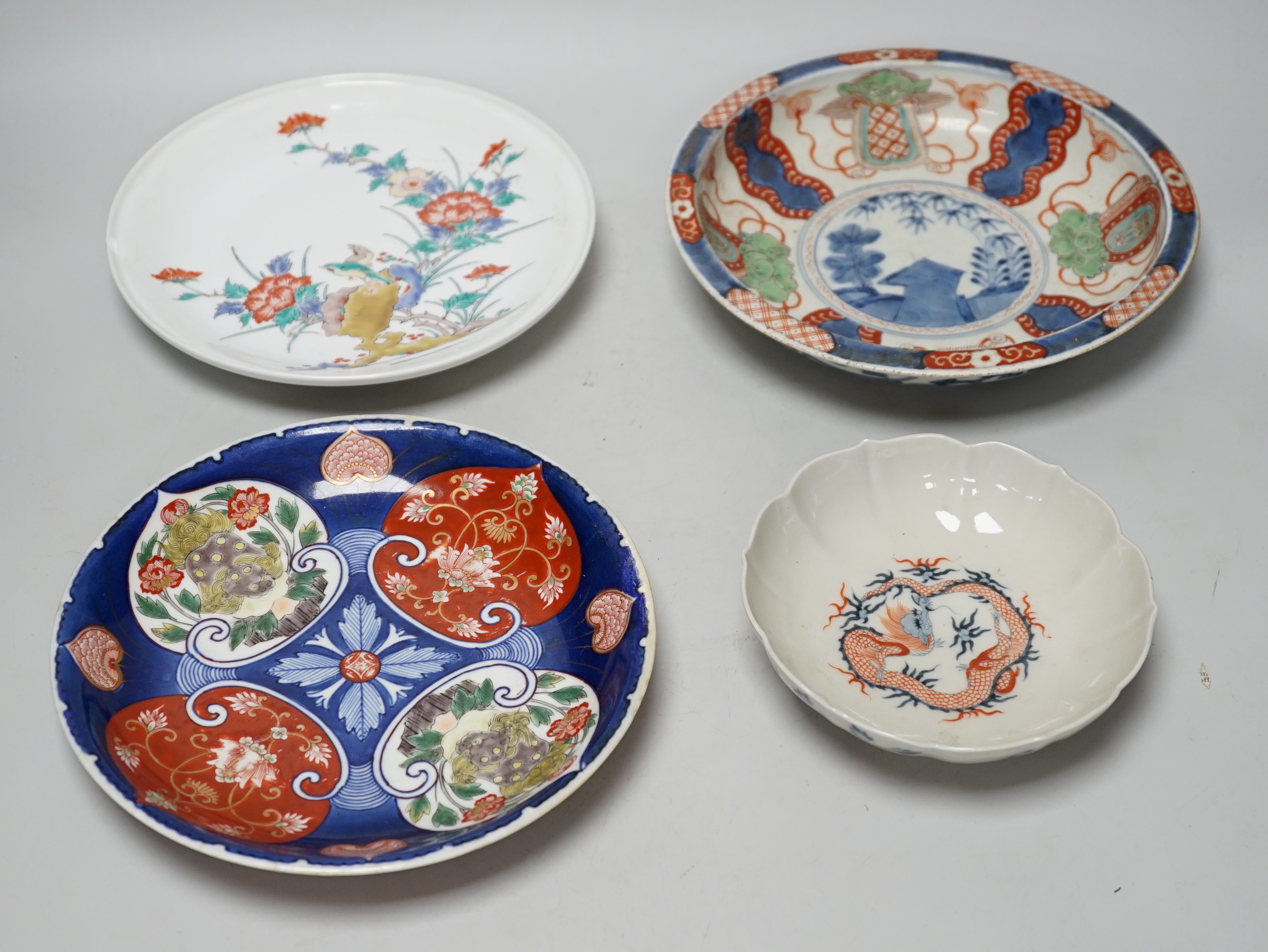 Four Japanese Arita plates/bowls, largest 23cm diameter